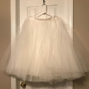 Off-white tulle skirt.